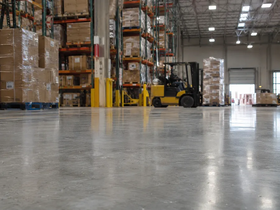Coated commercial or industrial floor